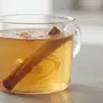 Side angle close up of honey and cinnamon for memory drink.