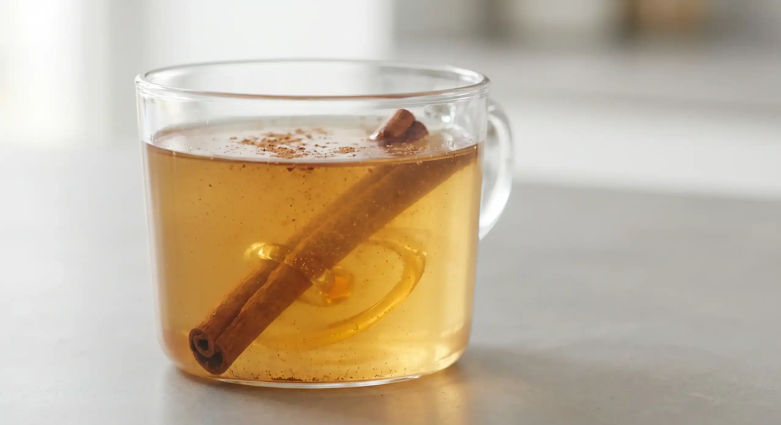 Side angle close up of honey and cinnamon for memory drink.