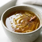 7 Easy Asian Honey Protocol Recipe Ideas for Cozy Brain Support 2 Asian honey protocol recipe in a warm mug with ginger, cinnamon, and lemon, zoomed in and realistic