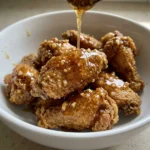 Honey garlic butter sauce drizzled over chicken wings